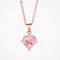 Rose quartz heart pendant necklace with rose gold-tone chain.